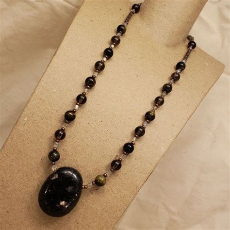The spiritual meaning of a tiger eye stone necklace: awakening your inner warrior